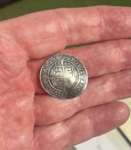 A Shiny Silver Hammered Tudor Sixpence Reveals Itself